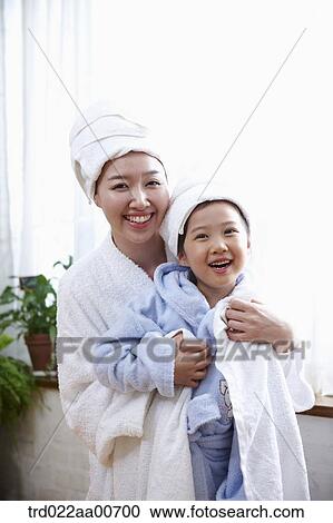 mother and daughter with bathrobe View Large Photo Image Stock Image - mother and daughter with bathrobe. Fotosearch