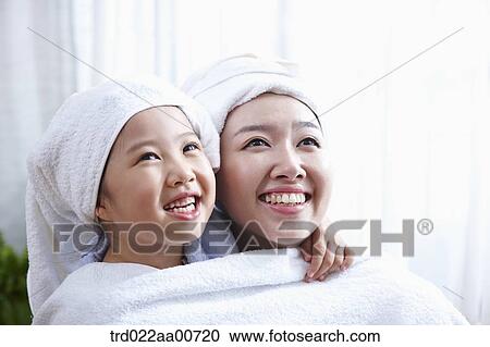 mother and daughter with bathrobe View Large Photo Image Stock Image - mother and daughter with bathrobe. Fotosearch