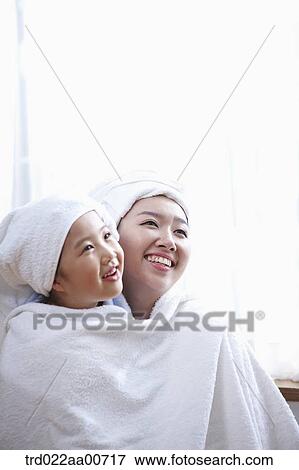 mother and daughter with bathrobe View Large Photo Image Stock Photo - mother and daughter with bathrobe. Fotosearch