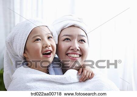 mother and daughter with bathrobe View Large Photo Image Stock Photo - mother and daughter with bathrobe. Fotosearch
