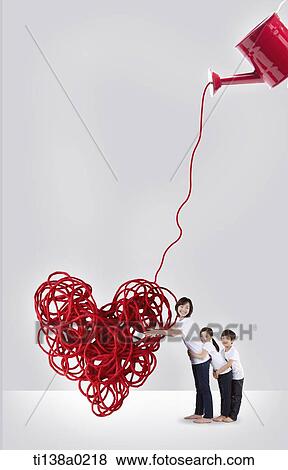 Stock Photo - mother and kids hugging a heart of wires. Fotosearch