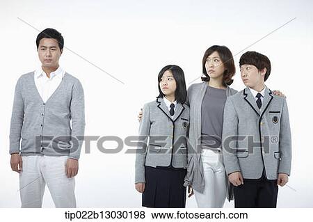 Stock Photo - parents next to children with school uniforms. Fotosearch