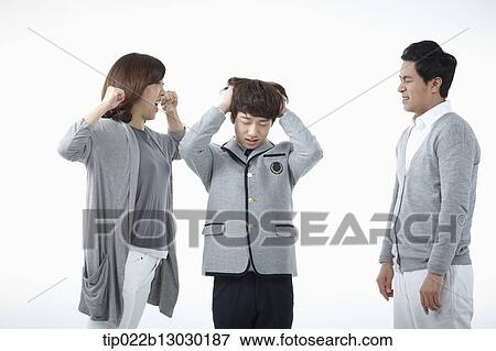 parents scolding at a son with a school uniform View Large Photo Image Stock Photo - parents scolding at a son with a school uniform. Fotosearch