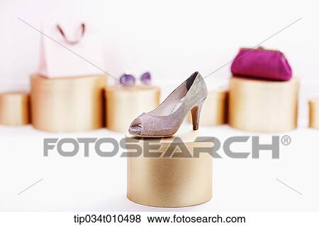Stock Photo - shopping items on golden boxes. Fotosearch