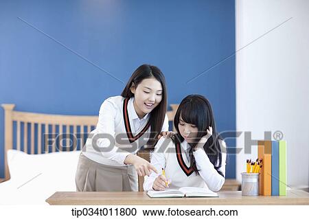 students in uniform at a desk View Large Photo Image Stock Image - students in uniform at a desk. Fotosearch