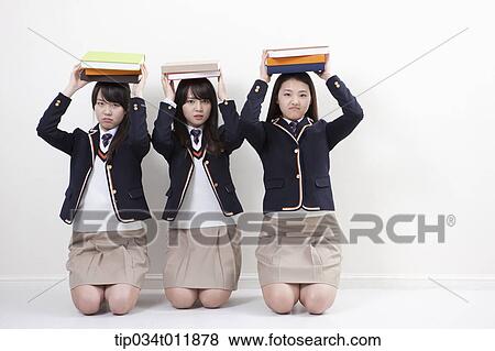 Stock Photo - students in uniform having punishment. Fotosearch