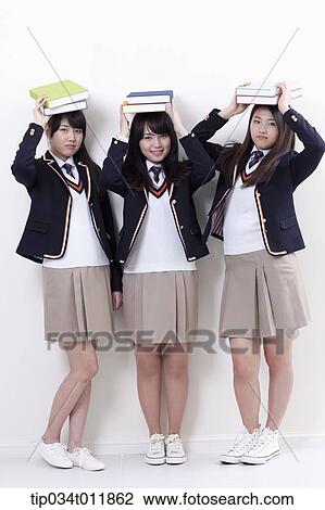 students in uniform holding books View Large Photo Image Stock Image - students in uniform holding books . Fotosearch
