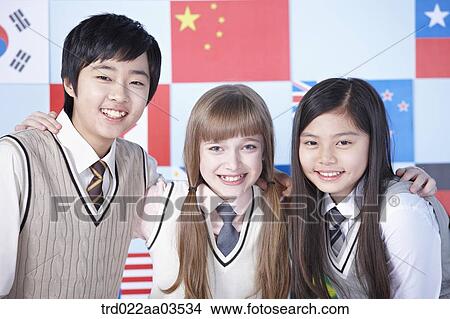 students in uniform posing in front of international flags View Large Photo Image Picture - students in uniform posing in front of international flags. Fotosearch