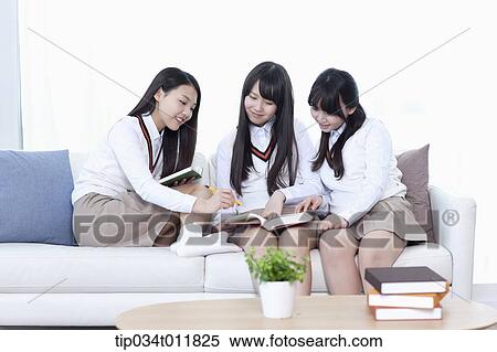 students in uniform sitting on a couch View Large Photo Image Stock Photography - students in uniform sitting on a couch. Fotosearch
