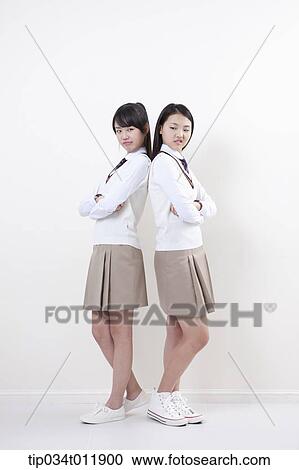 students in uniform standing back to back View Large Photo Image Stock Image - students in uniform standing back to back. Fotosearch