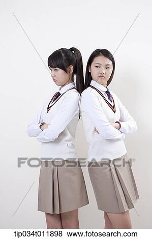 students in uniform standing back to back View Large Photo Image Stock Photo - students in uniform standing back to back. Fotosearch