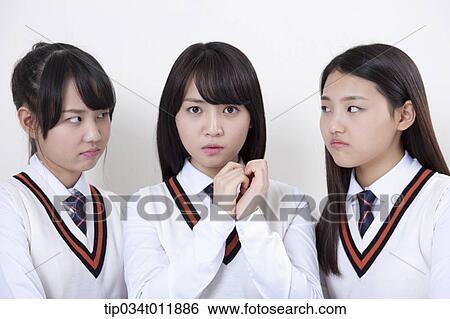 students in uniform staring at a friend View Large Photo Image Stock Photograph - students in uniform staring at a friend. Fotosearch