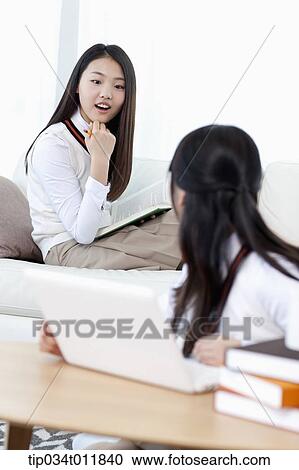 students in uniform studying together in a room View Large Photo Image Stock Image - students in uniform studying together in a room. Fotosearch