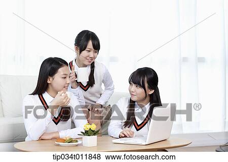 students in uniform studying together in a room View Large Photo Image Stock Photo - students in uniform studying together in a room. Fotosearch