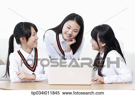 students in uniform studying together in a room View Large Photo Image Stock Photography - students in uniform studying together in a room. Fotosearch