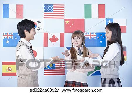 students in uniform talking in front of international flags View Large Photo Image Stock Photo - students in uniform talking in front of international flags. Fotosearch