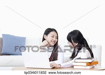 students in uniform using laptop together View Large Photo Image Stock Image - students in uniform using laptop together. Fotosearch
