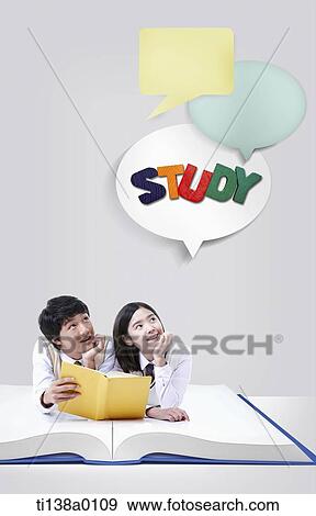students lying on a book View Large Photo Image Stock Photo - students lying on a book . Fotosearch