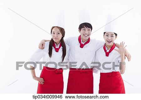 Stock Photograph - three cook with chef hats posing together in white background. Fotosearch