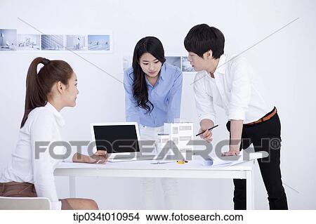 three interior designers working on a project View Large Photo Image Picture - three interior designers working on a project. Fotosearch