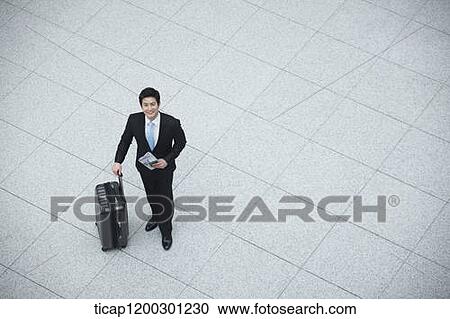 top down view of businessman with suitcase in the airport View Large Photo Image Stock Image - top down view of businessman with suitcase in the airport. Fotosearch