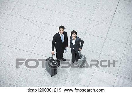 Stock Photo - top down view of businesswoman and businessman having a chat. Fotosearch