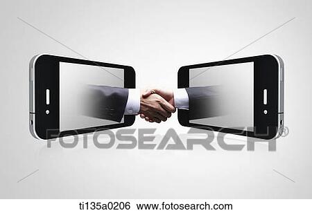 Stock Photograph - two businessman shaking hands from each mobile phone. Fotosearch