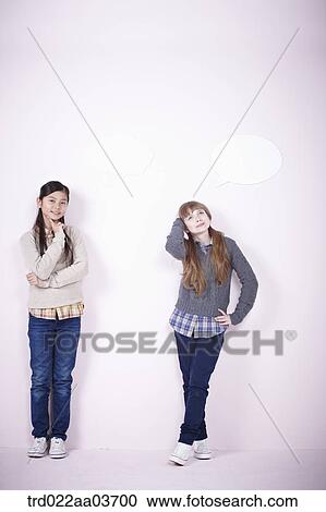 two girls standing together View Large Photo Image Stock Image - two girls standing together. Fotosearch