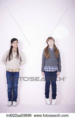 Stock Photograph - two girls standing together. Fotosearch