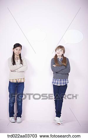 two girls standing together while one girl has speech bubble View Large Photo Image Stock Image - two girls standing together while one girl has speech bubble. Fotosearch