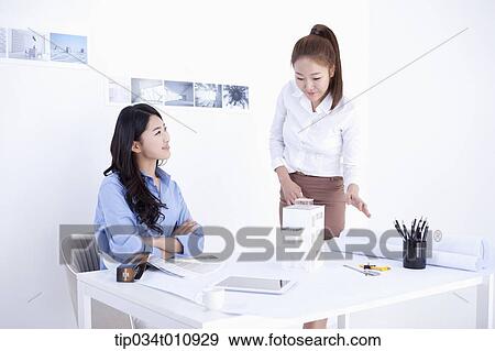 two interior designers working on a project View Large Photo Image Stock Photo - two interior designers working on a project. Fotosearch