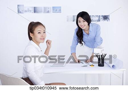 two interior designers working on a project View Large Photo Image Stock Photography - two interior designers working on a project. Fotosearch