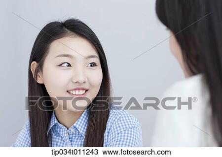 two ladies reading a book together View Large Photo Image Stock Image - two ladies reading a book together. Fotosearch