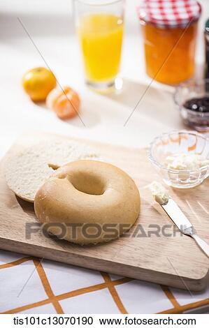 a bagel next to different jams View Large Photo Image Stock Image - a bagel next to different jams. Fotosearch