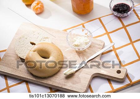 a bagel next to different jams View Large Photo Image Stock Photo - a bagel next to different jams. Fotosearch