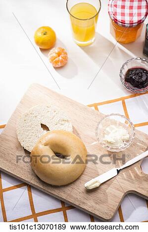 a bagel next to different jams View Large Photo Image Stock Photo - a bagel next to different jams. Fotosearch