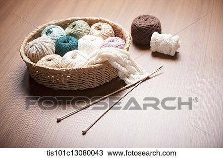 a basket of knit strings and knitting needle on wooden floor View Large Photo Image Stock Image - a basket of knit strings and knitting needle on wooden floor. Fotosearch