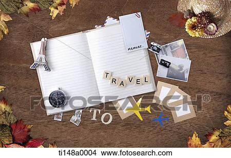a blank book with travel related items View Large Photo Image Picture - a blank book with travel related items. Fotosearch