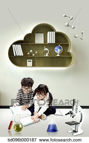a boy and a girl looking at a book together View Large Photo Image Stock Photo - a boy and a girl looking at a book together . Fotosearch