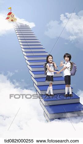 a boy and girl walking up the stairs in the sky View Large Photo Image Stock Photography - a boy and girl walking up the stairs in the sky . Fotosearch