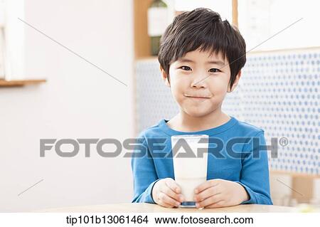 Picture - a boy drinking milk. Fotosearch