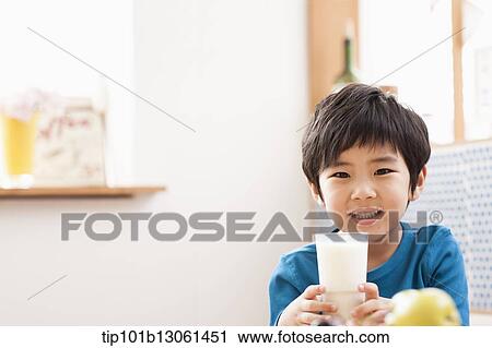 Stock Image - a boy drinking milk. Fotosearch