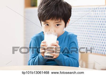Stock Photo - a boy drinking milk. Fotosearch