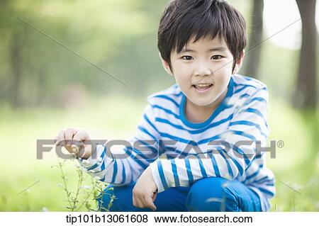 a boy exploring the nature View Large Photo Image Stock Photo - a boy exploring the nature. Fotosearch