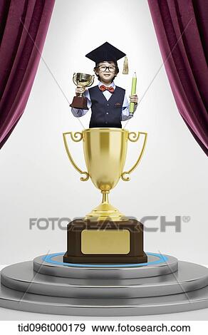 Stock Photo - a boy inside a trophy with graduation hat . Fotosearch