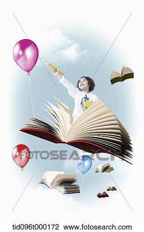 Stock Image - a boy is sitting on a book flying . Fotosearch