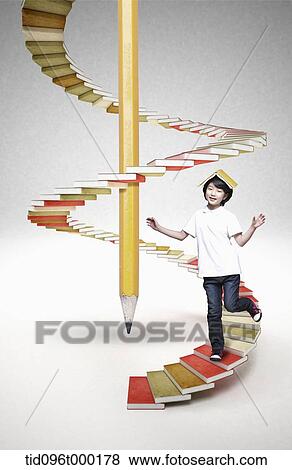 a boy on stairs with books View Large Photo Image Stock Photo - a boy on stairs with books . Fotosearch