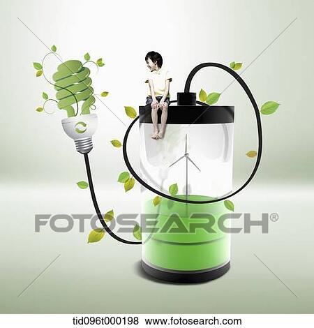 a boy sitting on a green battery View Large Photo Image Stock Photo - a boy sitting on a green battery . Fotosearch