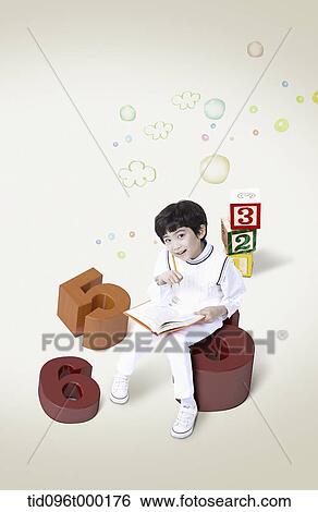 a boy sitting on number View Large Photo Image Stock Photograph - a boy sitting on number . Fotosearch
