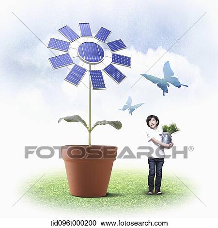 Stock Image - a boy standing next to a flower with solar panels. Fotosearch